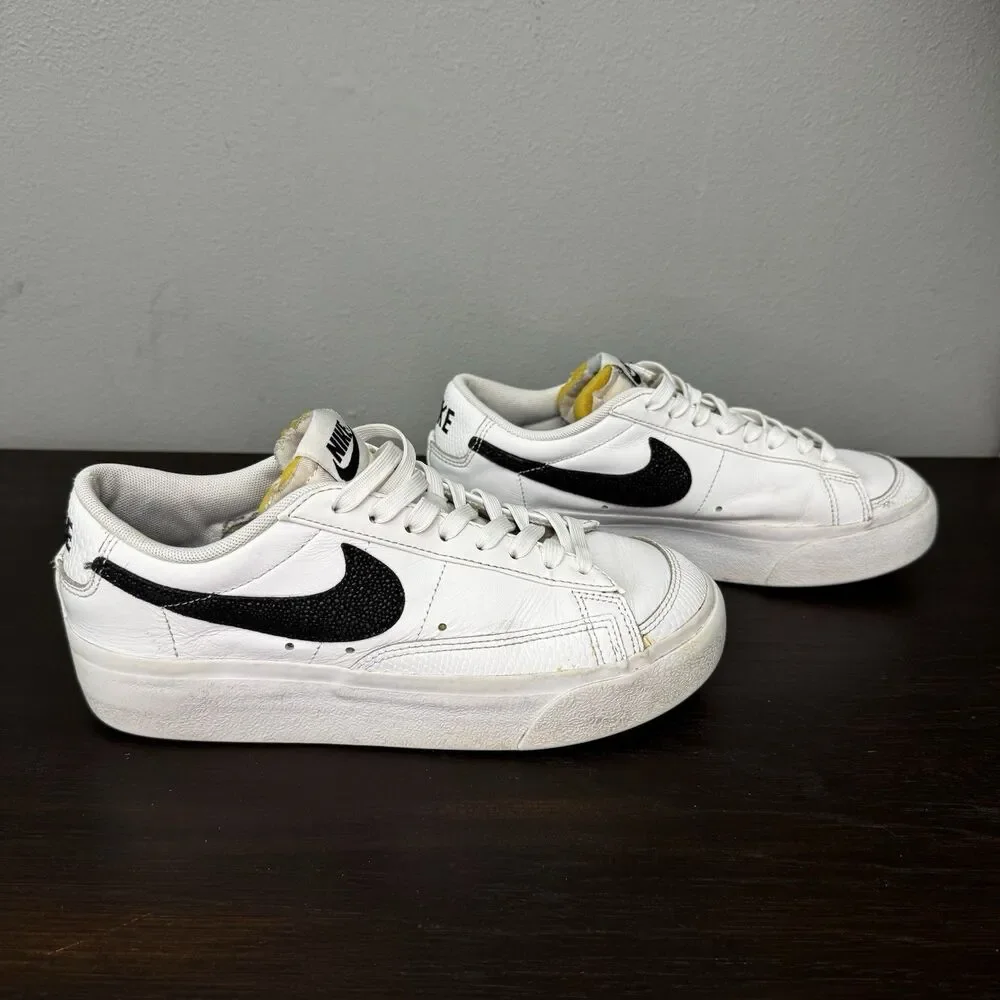 Nike White Leather Low-Top Sneakers with Black Swoosh and Yellow Tongue